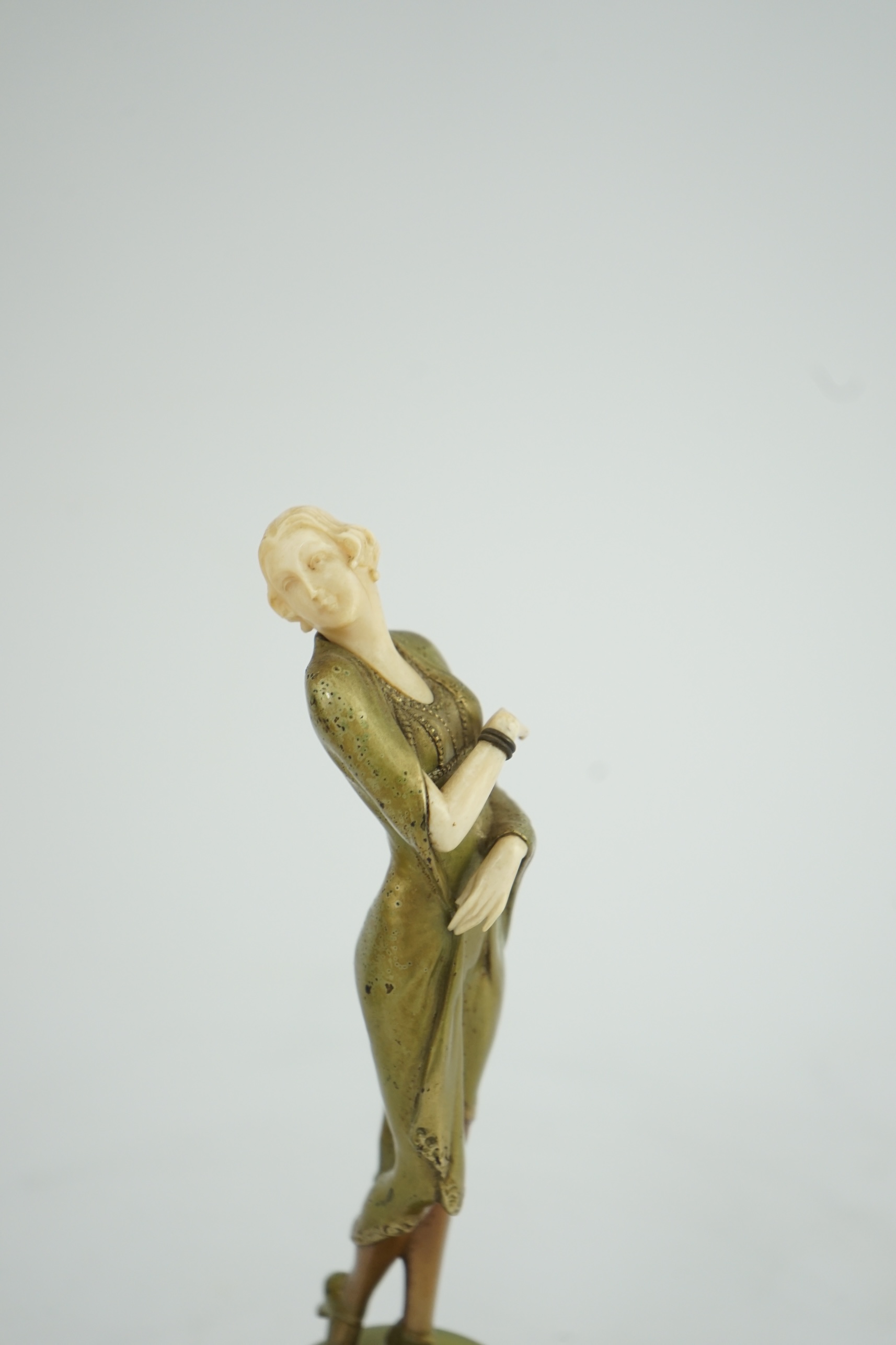 Attributed to Josef Lorenzl. An Art Deco bronze and ivory figure of a stylish lady